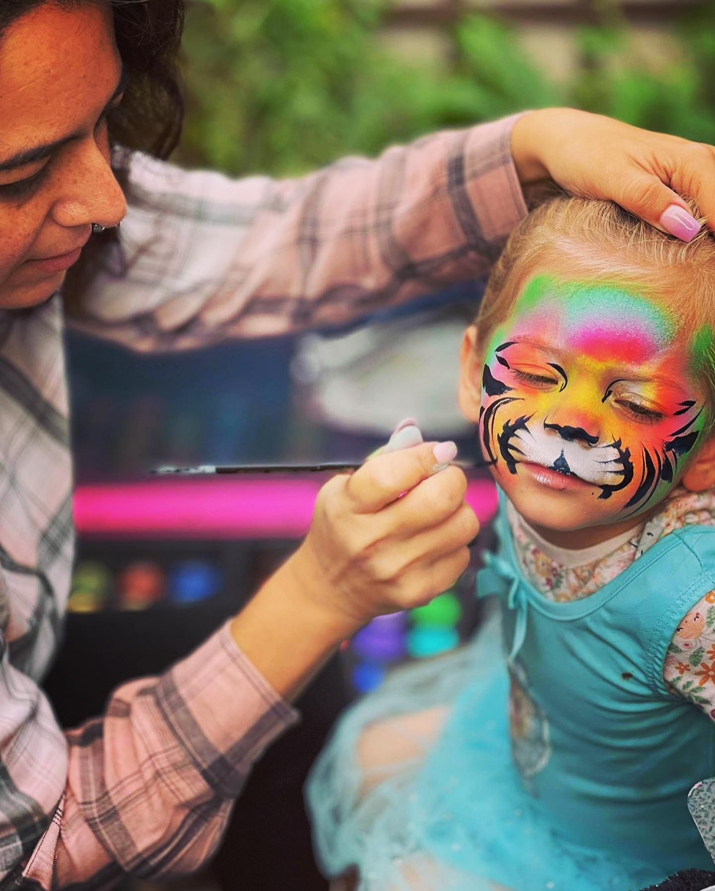 Professional face painting at a London event bu Moondust Face & Body Art