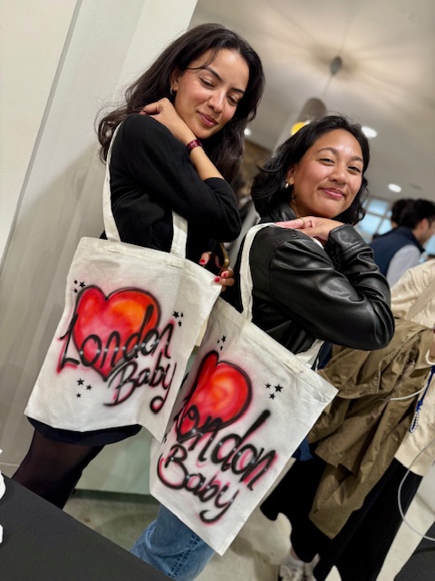 Airbrushed tote bags with names and logos for corporate brand activation event
